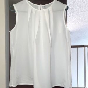 Never worn Uniqlo top. Tags attached. Size: Large